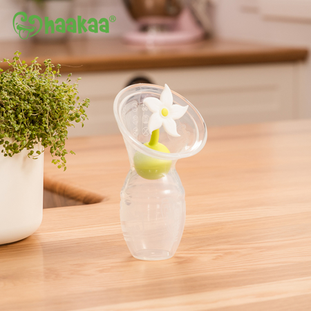 Haakaa® Set silikonska črpalka 1.gen. 100ml in Pokrovček Rožica