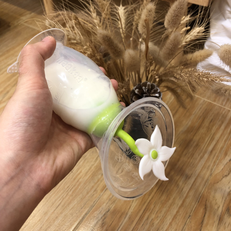 Haakaa® Silikonska črpalka 2.gen. 100ml in Pokrovček Rožica