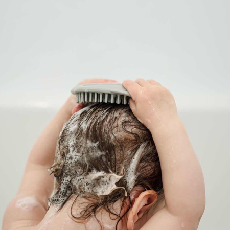 Haakaa® Silikonska krtača za umivanje glave